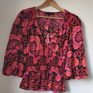 House of Harlow 1960 balloon sleeve peplum motif top